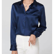 Navy silk shirt worn by a model, shown from the front.