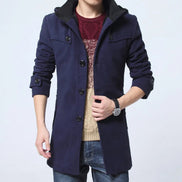 Navy blue coat worn by a person on a light gray background