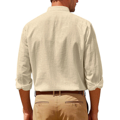 Back view of men's khaki linen blend stand collar shirt with rolled sleeves, tucked into khaki trousers with a brown belt