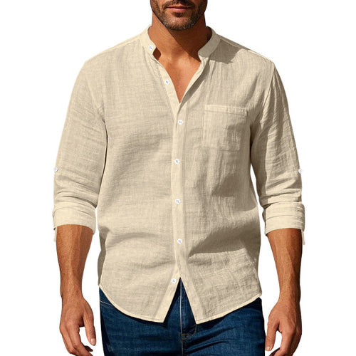 Men's khaki linen blend stand collar shirt with a button front, chest pocket, and rolled sleeves, worn with dark blue jeans