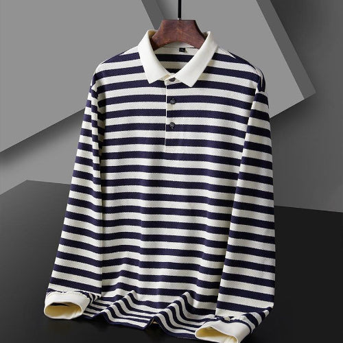 Men's navy blue and white striped long sleeve polo shirt on a wooden hanger, showing the white collar, three-button placket, and white cuffs
