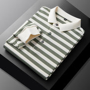 Men's green and white striped long sleeve polo shirt folded to show the white collar, three-button placket, and white cuff