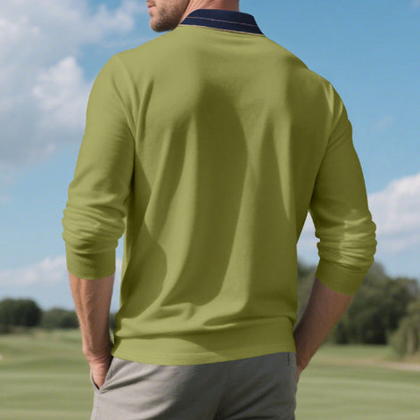 Angled front view of men's army green long sleeve polo shirt with a contrasting navy collar and three-button placket, modeled beside golf clubs on a golf course