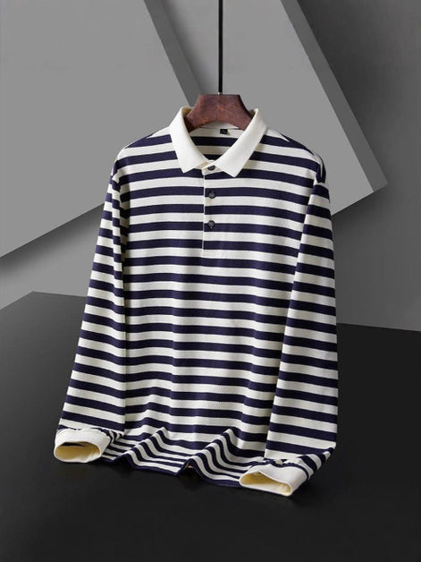 Men's long sleeve polo shirt with dark and white horizontal stripes, a white collar, and a three-button placket on a hanger