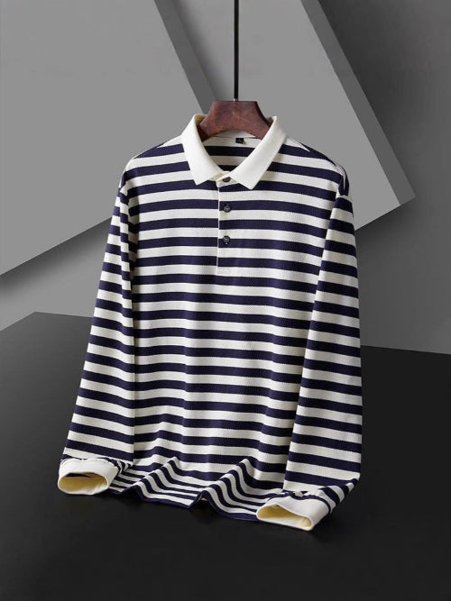 Men's long sleeve polo shirt with dark and white horizontal stripes, a white collar, and a three-button placket on a hanger