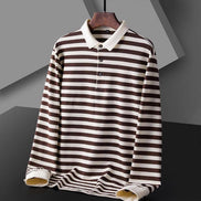 Men's dark red and white striped long sleeve polo shirt with a white collar and three-button placket on a wooden hanger