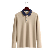 Men's khaki long sleeve polo shirt with a contrasting navy collar, fine collar stripes, and three-button placket on a wooden hanger