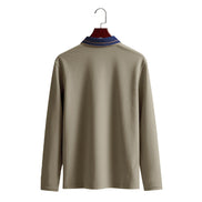 Back view of men's taupe long sleeve polo shirt with a contrasting navy collar and fine collar stripes on a wooden hanger