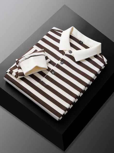 Men's brown and white striped long sleeve polo shirt folded to show the white collar, three-button placket, and white cuff