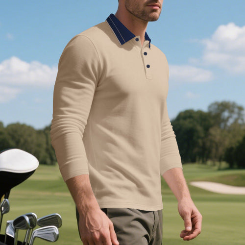 Angled front view of men's khaki long sleeve polo shirt with a contrasting dark collar and three-button placket, modeled beside golf clubs on a golf course