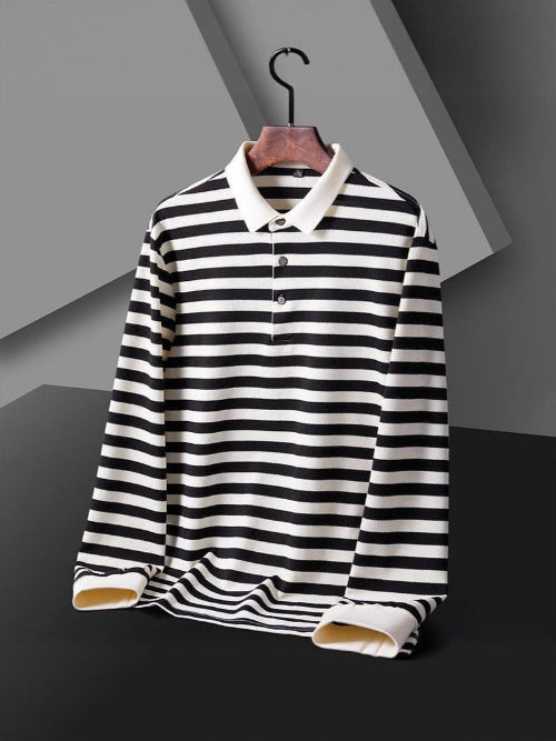 Men's black and white striped long sleeve polo shirt with a white collar and three-button placket on a wooden hanger