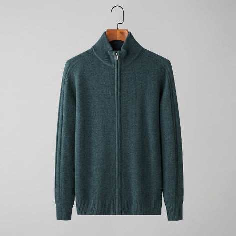 A men's dark teal-green knit zip-up sweater with a mock neck, displayed on a wooden hanger against a light gray background.