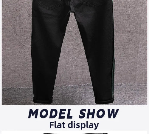 Black slim-fit jeans shown flat against a textured gray background, with a white banner at the bottom reading 'MODEL SHOW Flat display'.