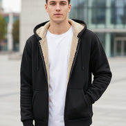 Black hoodie with white lining on a textured gray background