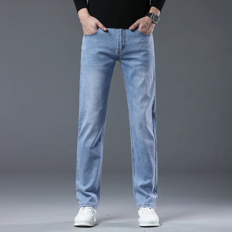 Light blue jeans worn by a person on a gray background