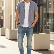 Pair of blue leather shoes with black accents on a white background