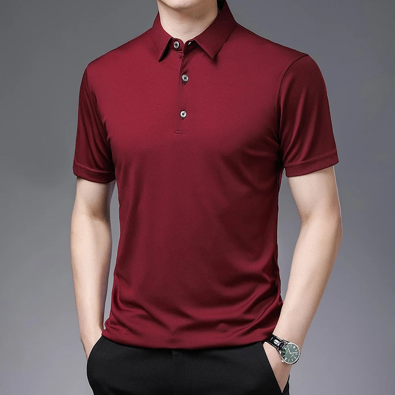 Maroon polo shirt worn by a person on a gray background