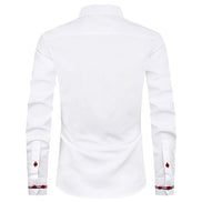 White long-sleeve dress shirt shown from the back, featuring a pointed collar and decorative red and black patterned cufflinks on the sleeves.
