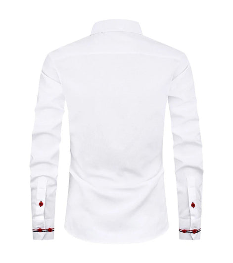 White long-sleeve dress shirt shown from the back, featuring a pointed collar and decorative red and black patterned cufflinks on the sleeves.