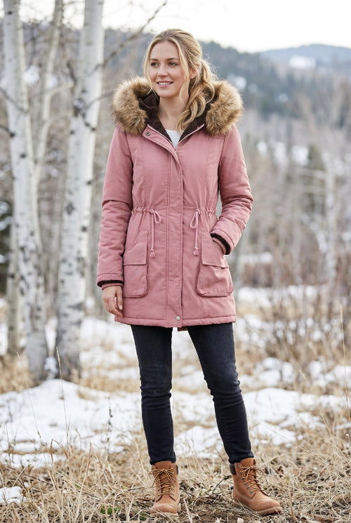 Pink winter coat with fur-lined hood on a white background