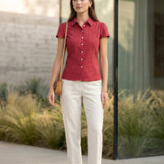 Red checkered shirt with a tag on a light gray background
