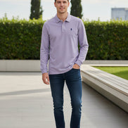 Purple long-sleeve polo shirt on a hanger with other shirts in the background