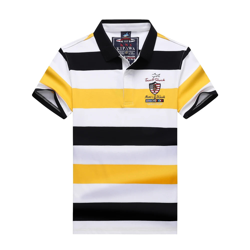 A short-sleeve polo shirt with horizontal stripes of black, white, and yellow. It features a black collar, a small embroidered crest on the left chest, and a visible 'KIP 1914' brand label inside the collar.