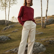 A solid red crewneck sweatshirt with long sleeves and ribbed cuffs and hem, 