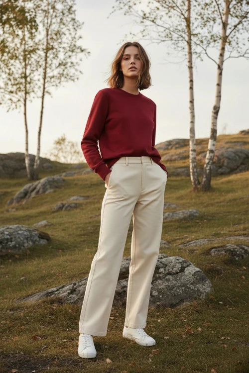 A solid red crewneck sweatshirt with long sleeves and ribbed cuffs and hem, 