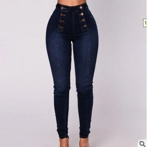 Dark blue jeans with button details on a light gray background