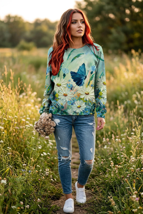 A woman wearing a long-sleeve crewneck sweatshirt with a vibrant 3D floral and butterfly print. 