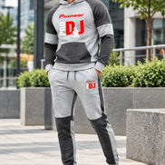A two-piece athletic loungewear set consisting of a raglan hoodie and matching joggers in heather gray and dark gray. 