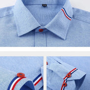 Light blue long-sleeve polo shirt shown in three close-up detail views, highlighting the collar, button placket, and folded cuff with red and navy striped trim.