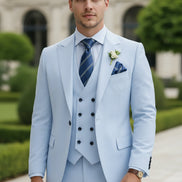 Light blue suit with a striped tie and boutonniere on a white background