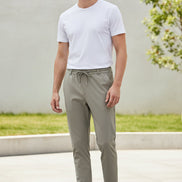 Two pairs of beige pants on a white background