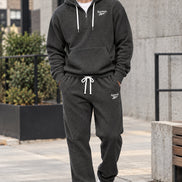 Gray hoodie and pants set with Lacoste logo on a white background