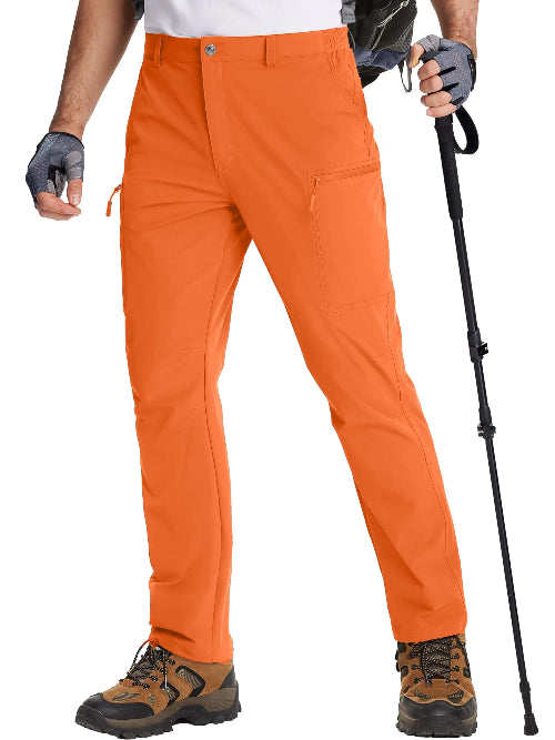 Person wearing orange hiking pants with hiking gear on a white background