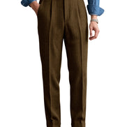 Dark brown herringbone pleated suit trousers shown on a white background