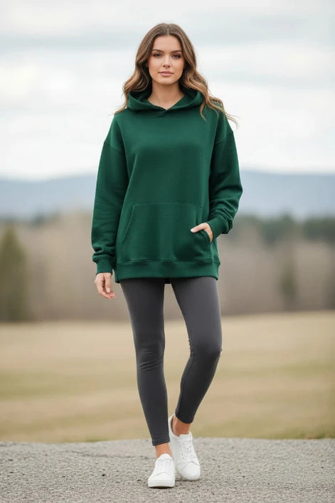 Green hoodie worn by a person on a white background