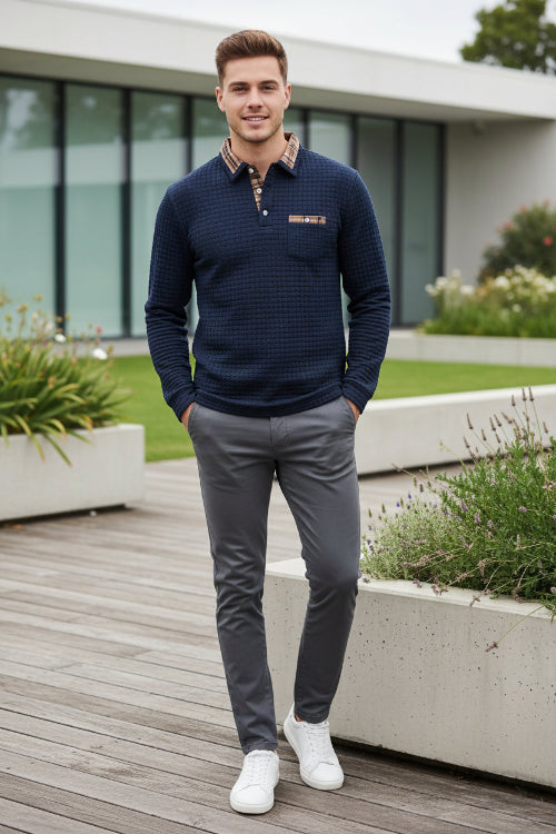 Navy blue textured sweater with plaid collar and pocket on a white background