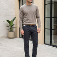 A pair of dark slate blue chino pants shown flat against a solid white background.