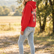 A red pullover hoodie shown on a model from both front and back. The front has vertical text reading 'Jesus IS THE LIGHT' 