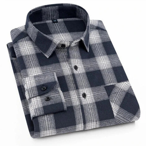 Folded plaid shirt with black and gray pattern on a white background