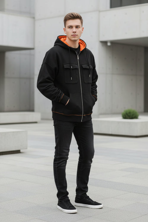 Black hoodie with orange lining on a white background