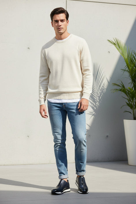 Pair of navy blue shoes with white soles on a light gray background
