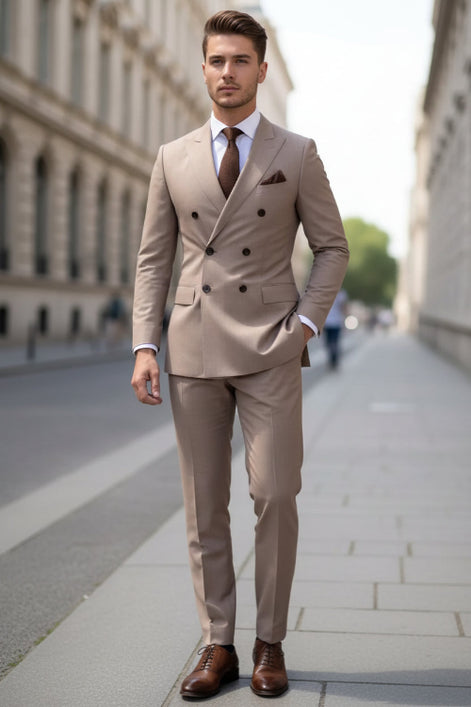 Beige double-breasted suit with a brown tie and pocket square against a blurred background