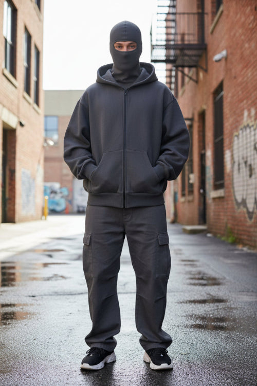 A dark gray zip-up hoodie with a unique integrated balaclava hood, shown against a plain white background.