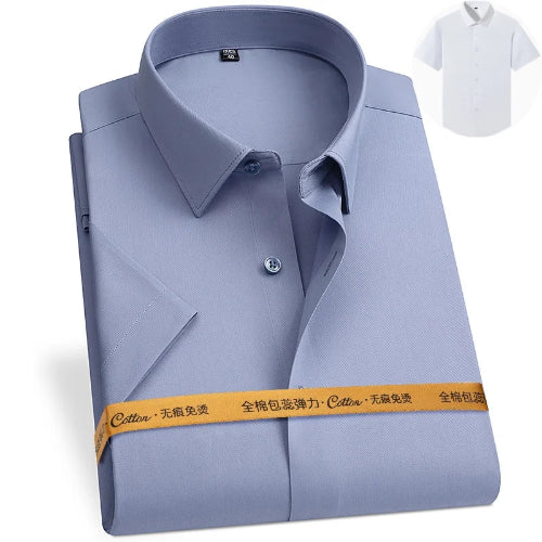 Folded light blue shirt with a white shirt in the corner on a white background