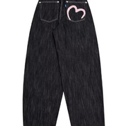 Back view of dark-wash loose-fit jeans with contrast stitching and a pink heart outline on the right back pocket, displayed on a white background.