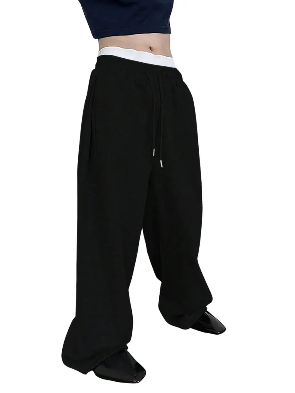 Black wide-leg pants worn by a person on a white background